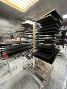 Refinished cabinets drying horizontally.
