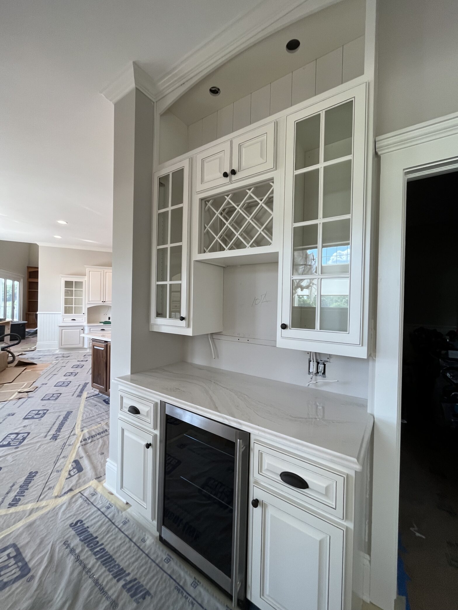 A set of custom-designed cabinets that have been refinished by Craine Painting in a crisp white.
