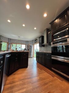 Refinished kitchen in Muskego, WI. Cabinets finished in deep brown stain.