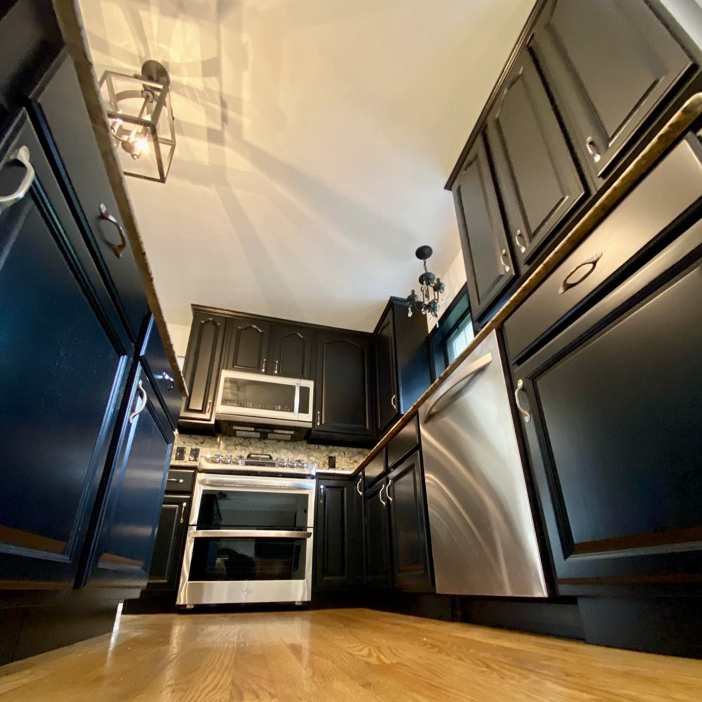 Cabinetry refinished in black by Craine Painting in Lake Geneva, Wisconsin