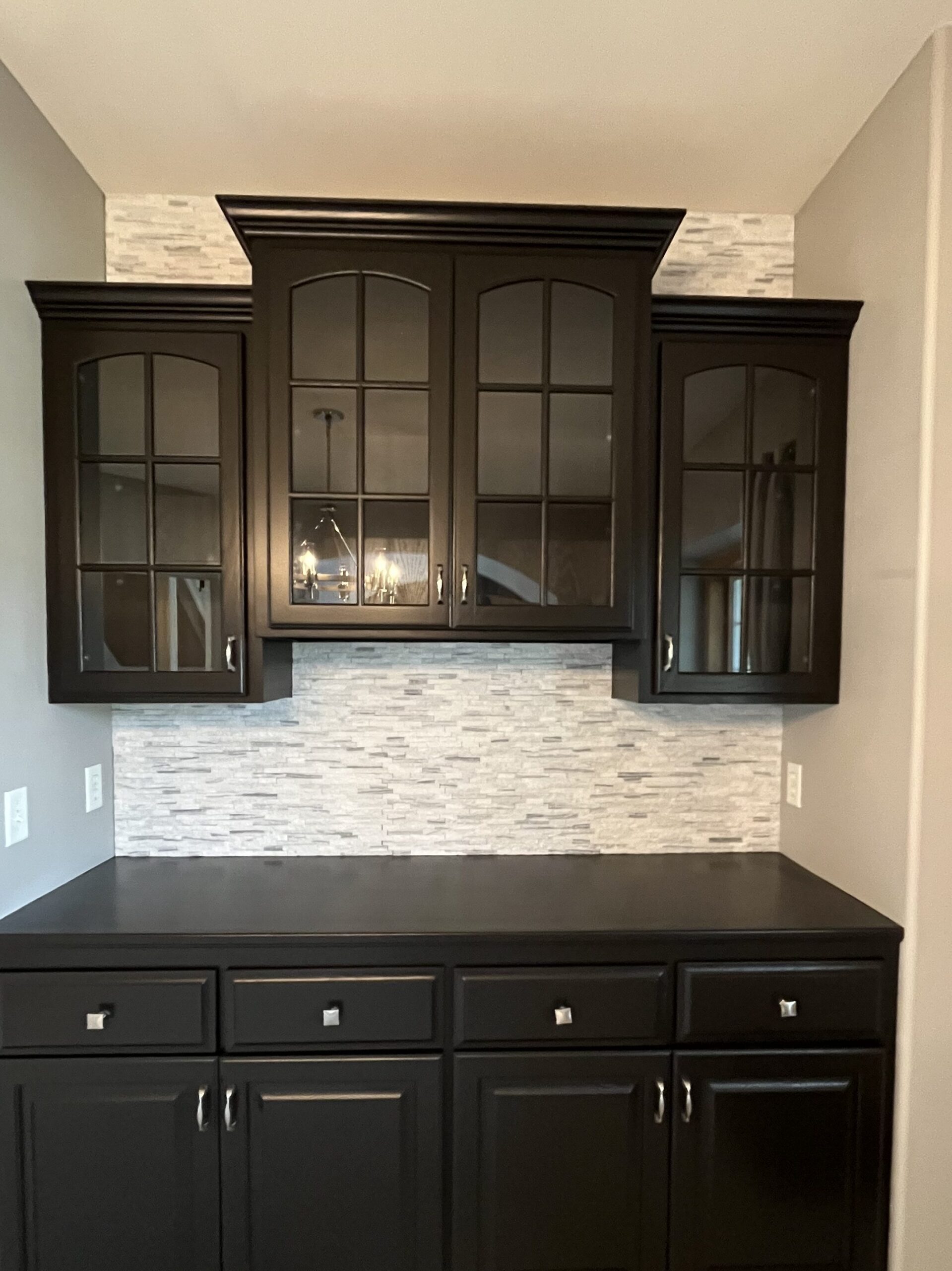 Built-in refinished in deep brown by Craine Painting